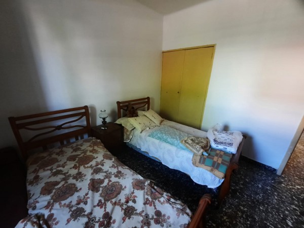 RETASADA VENDO CASA 2 DORMITORIOS CON COCHERA BARRIO SAN MARTIN